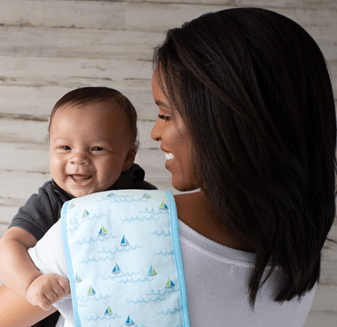 Burp cloths are placed over your shoulder to catch any spit and spills. - How Many Burp Cloths Do I Need | Baby Journey 