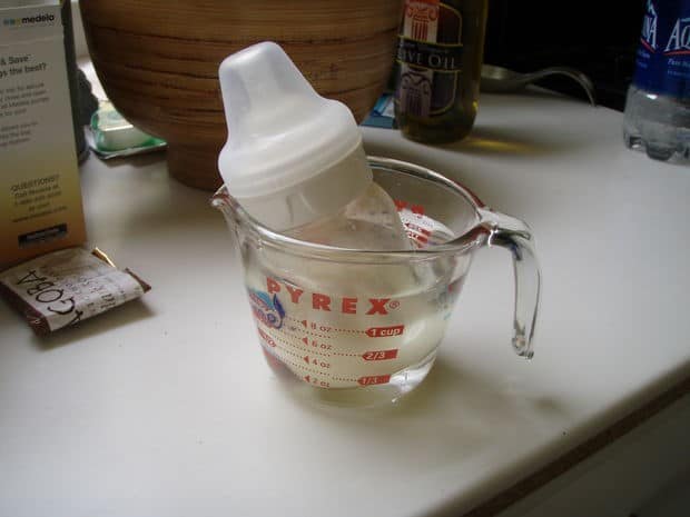 Simply immerse the milk bottle in a jug or pot of hot water for a few minutes to warm it.- How to Warm a Baby Bottle | Baby Journey
