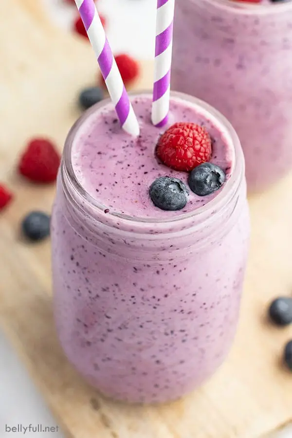 Garnish blueberry smoothie with fresh fruit and serve with an attractive straw! - 16 Irresistibly Yummy Smoothie Recipes for Kids and Toddlers | Baby Journey Blog