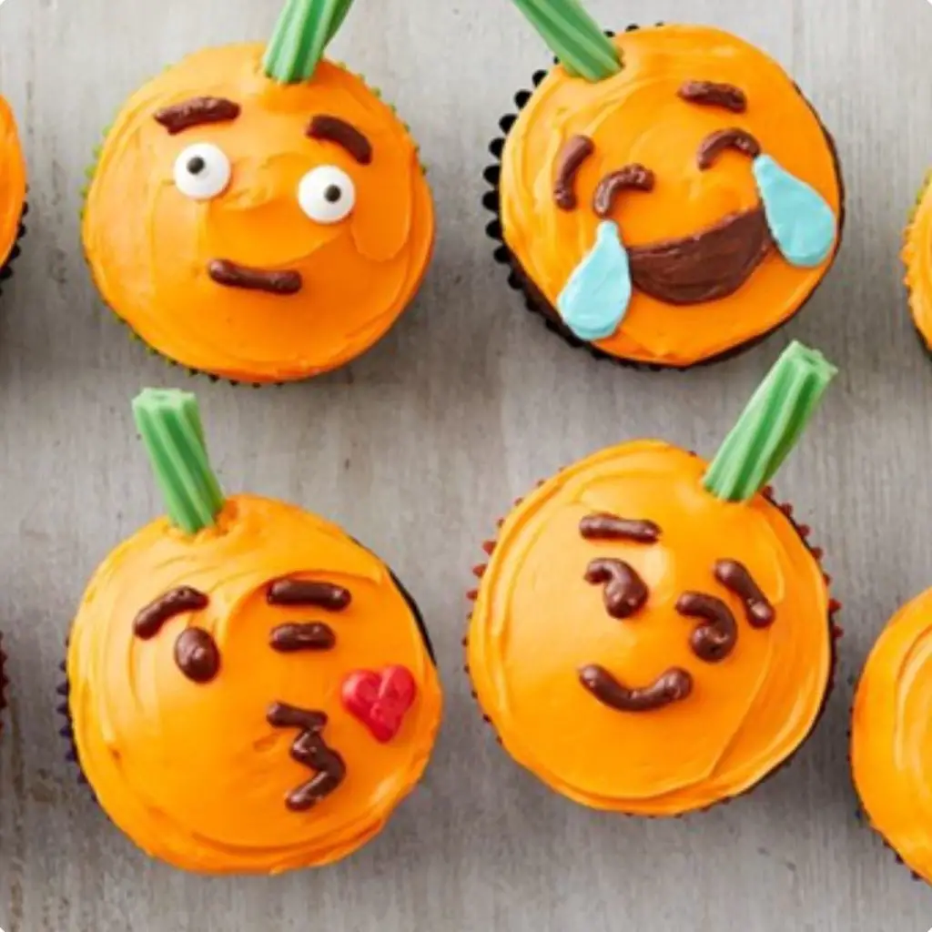 Pumpkin Face Cupcake - 42 Unique Baby Shower Cakes and Baby Shower Cupcakes Ideas - Baby Journey Blog