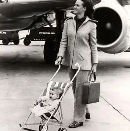 Lady posing with a baby in the MacLaren B-01 Baby Buggy - When Were Strollers Invented History of Baby Strollers – Baby Journey