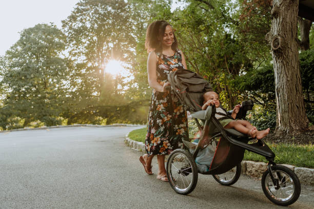 Mother Using Bob Stroller for a Quick Stroll in the Park | Best Bob Strollers | Baby Journey
