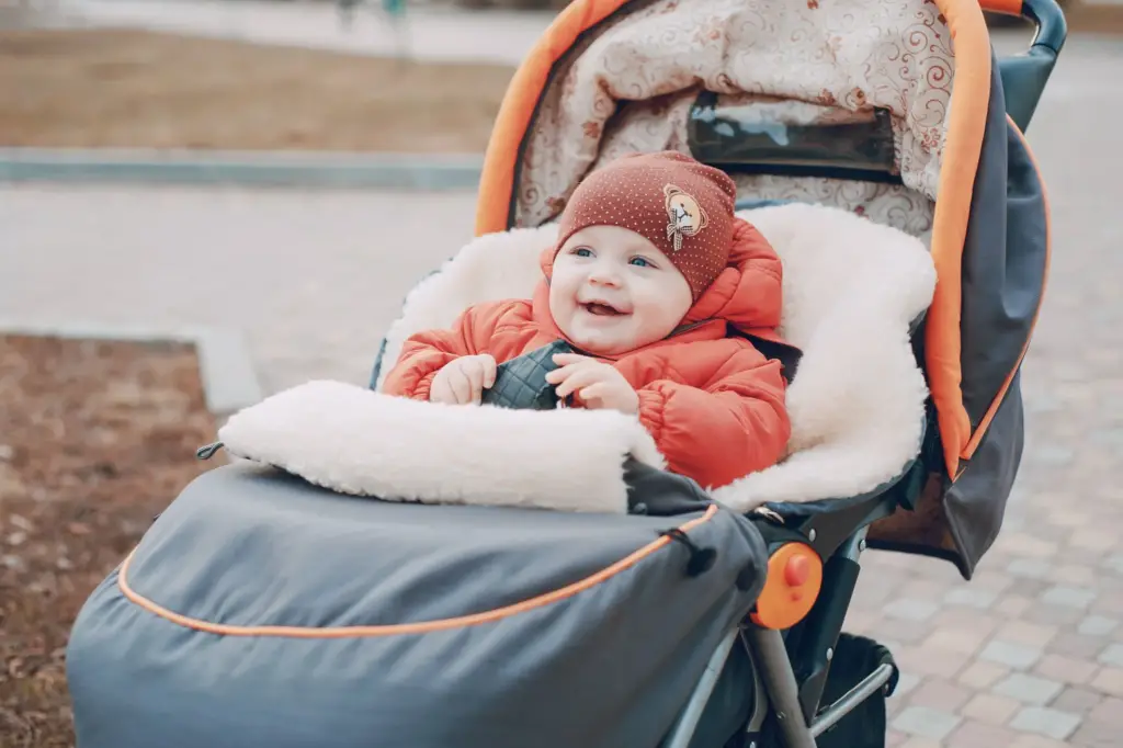 Baby dressed up with jacket and hat -  Why Do Babies In Denmark Sleep Outside - Baby Journey
