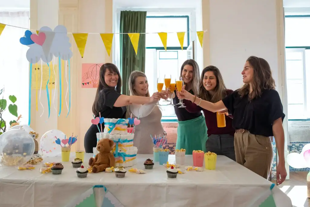Mother-to-be and the guests are celebrating baby shower- Places to Have a Baby Shower - Baby Journey