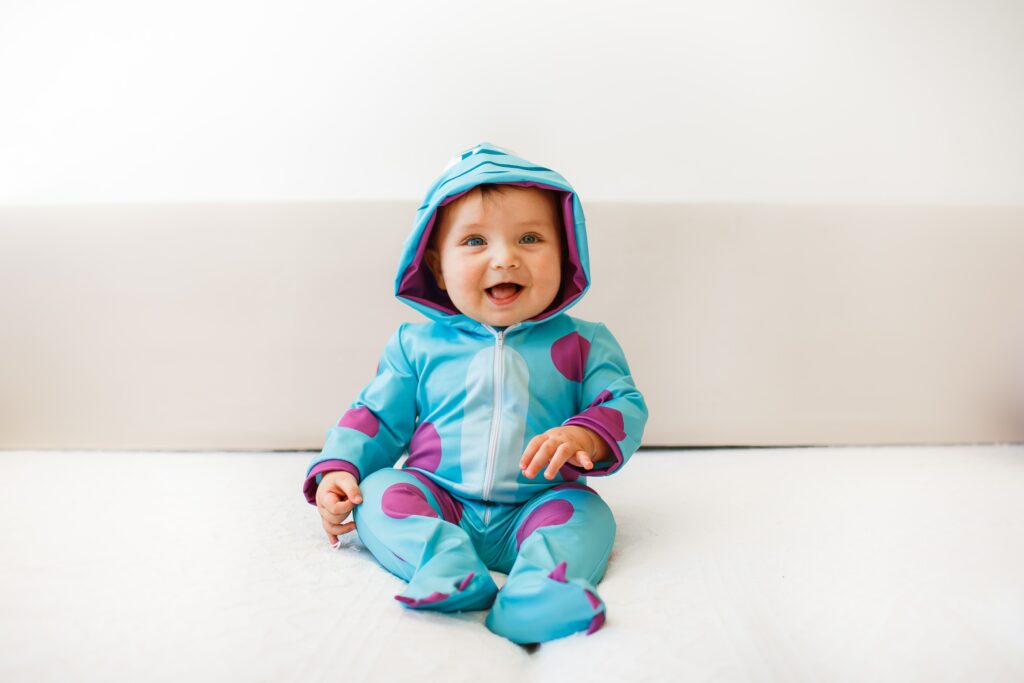 Baby boy wearing a onesie of Sulley's character from Beast Kingdom - Funny Baby Onesies - Baby Journey