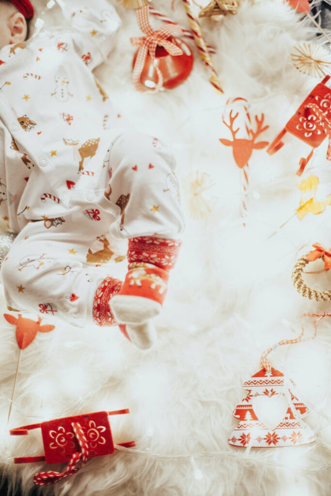 Baby wearing a Christmas themed onesie - Funny Baby Onesies - Baby Journey