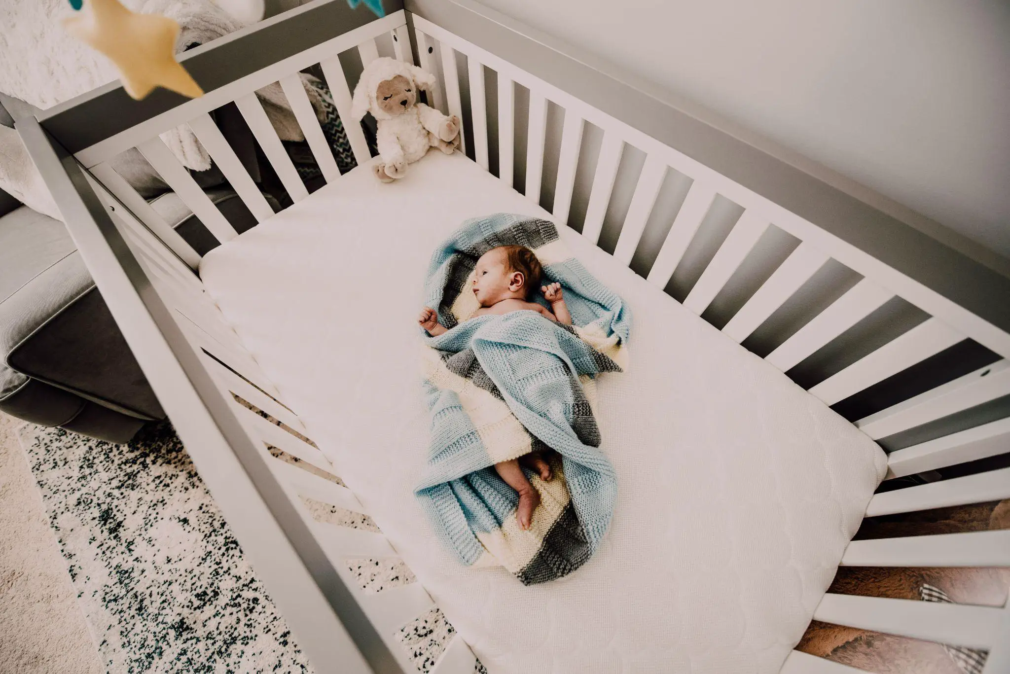 Baby sleeping in the crib - Should You Get A Crib Vs Pack And Play For Baby - Baby Journey