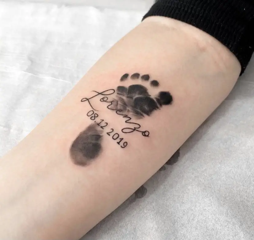 Parent incorporate the name and birth date of their child into their baby footprint tattoo - Baby Footprint Tattoo - Baby Journey