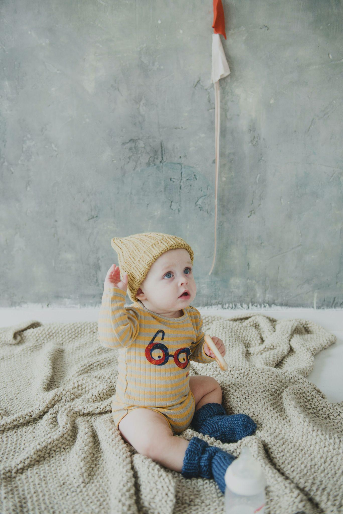 Baby boy wearing a onesie that match with woolen cap - Funny Baby Onesies - Baby Journey