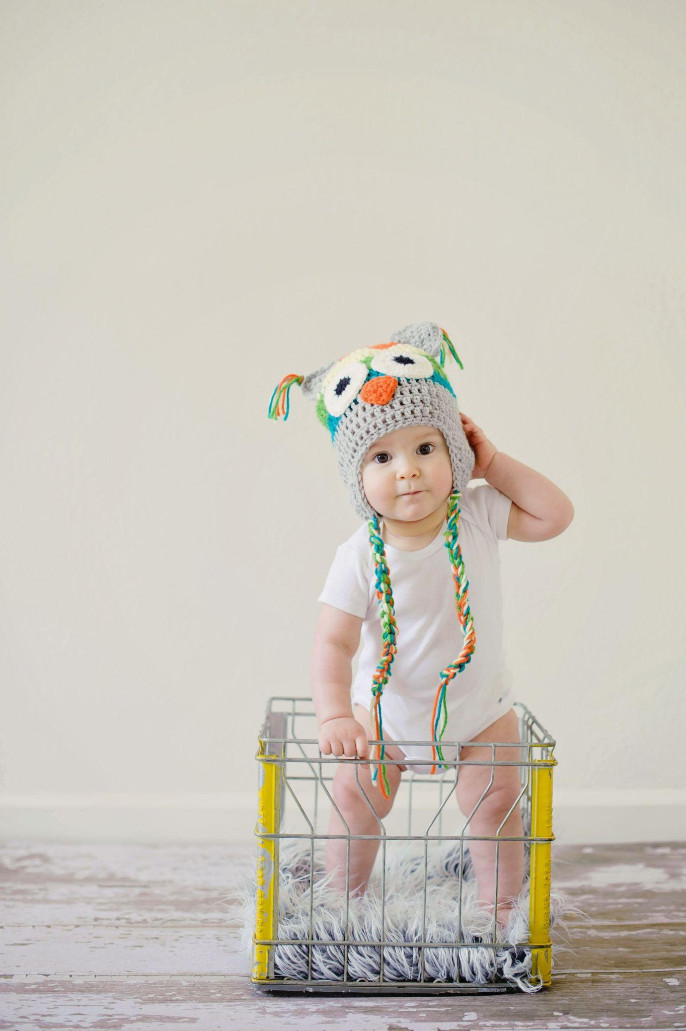 Newborn baby wearing a headband as a accessories for a photo shoot - Newborn Photoshoot - Baby Journey
