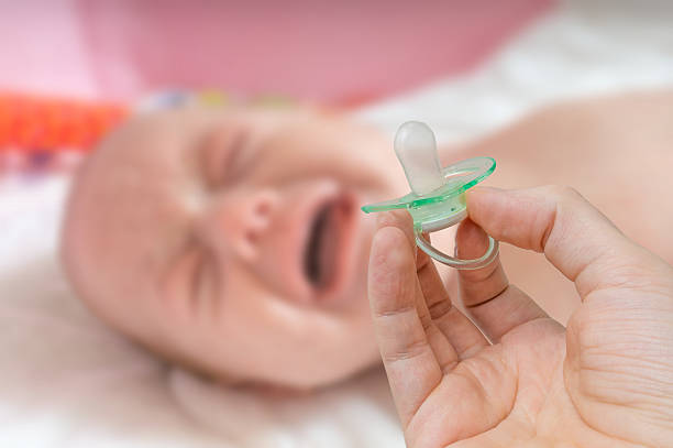 Baby Crying when Pacifier Falls - How Do I Stop My Baby From Crying When Her Pacifier Falls Out - Baby Journey