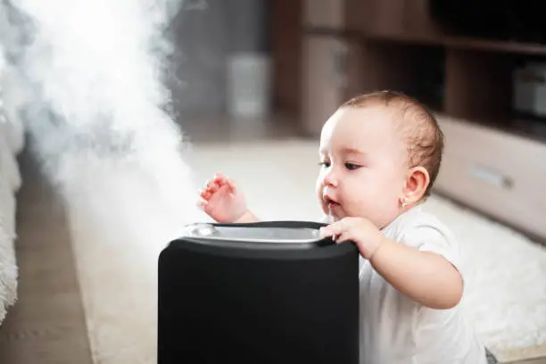 Baby curious about humidifier - How Close Should a Humidifier Be to a Baby - Baby Journey
