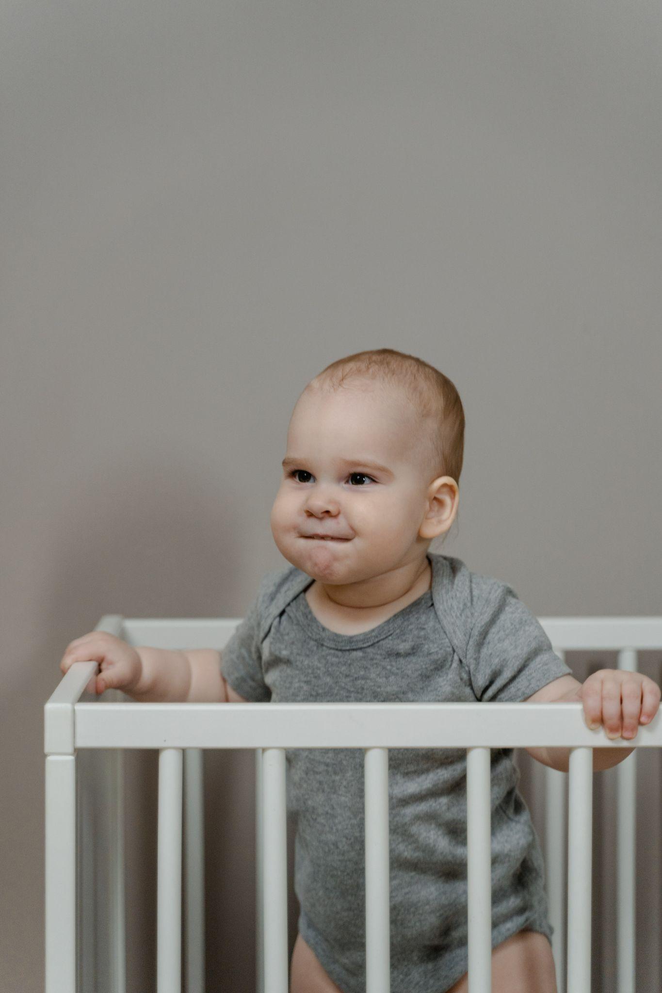 Boy making faces in his crib - Toddler Climbing Out of Crib - Baby Journey