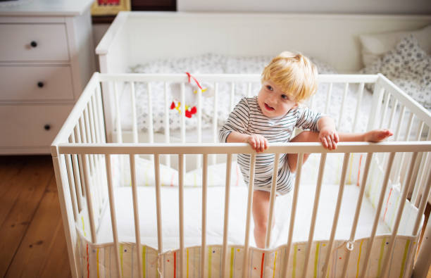 Boy attempts to climb out of crib - Toddler Climbing Out of Crib - Baby Journey