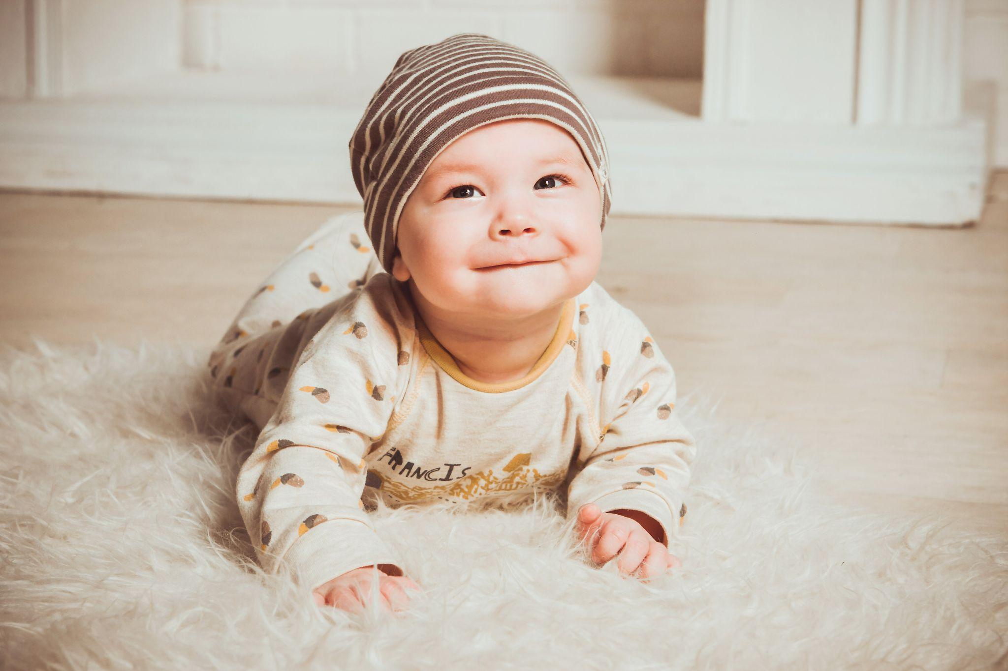 Baby smiles for the camera - Can Babies Sense Pregnancy Before You - Baby Journey