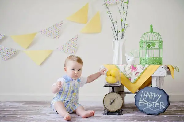 Baby boy is sit on floor and hold lemons - 400+ Names That Mean Beautiful for Girls and Boys - Baby Journey